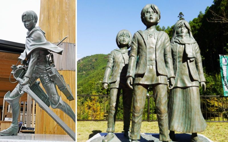 bức tượng các nhân vật của attack on titan đặt trong thành phố